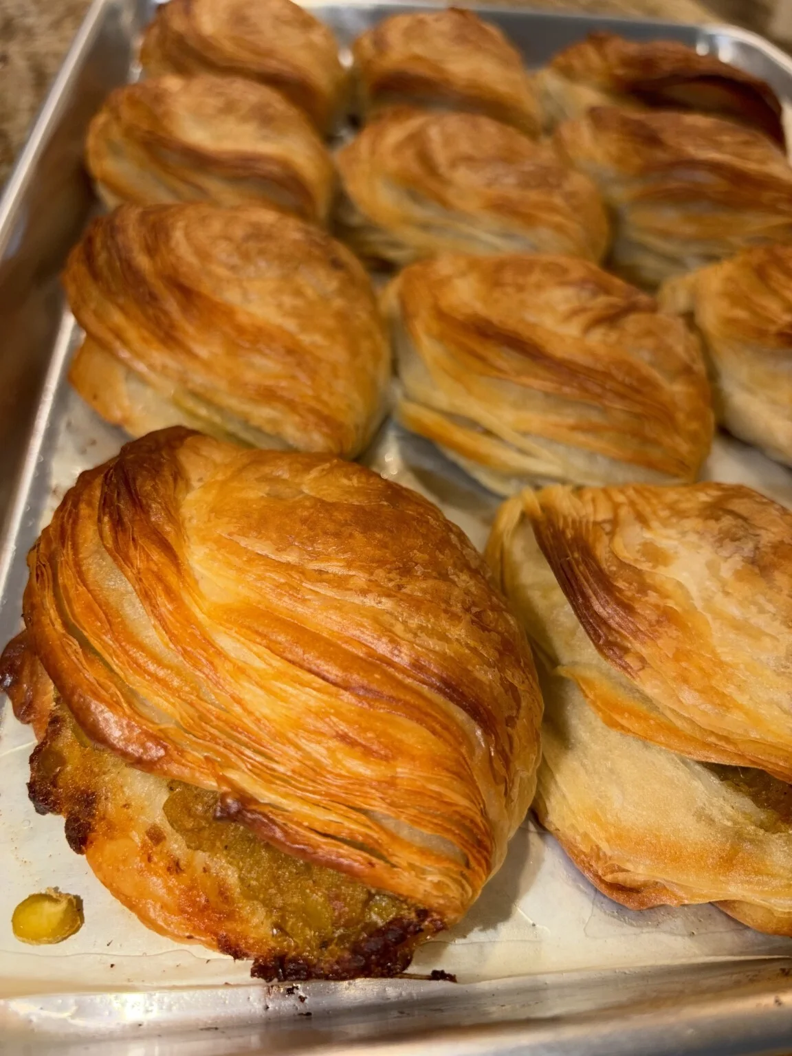 A tray of golden Maltese pastizzi